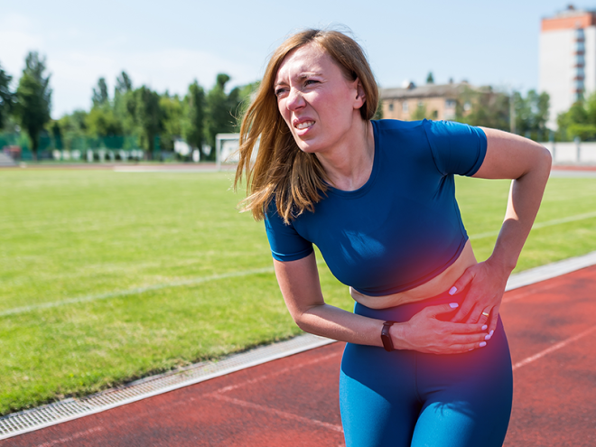 Runner experiencing hip impingement on a track