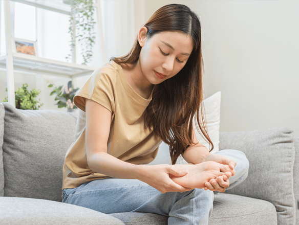 woman with plantar fasciitis pain in foot