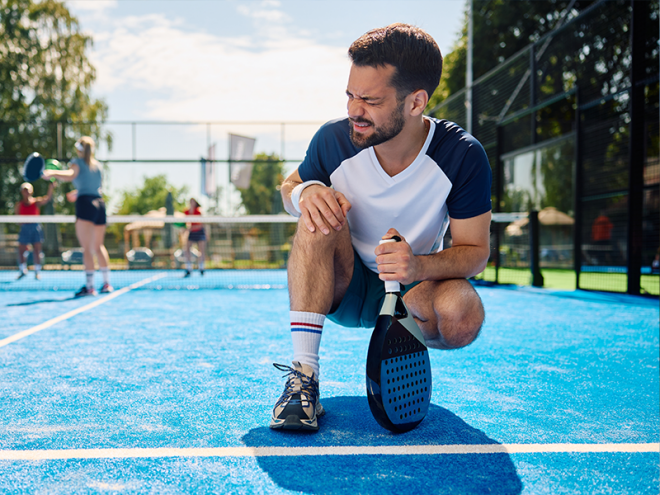 man with knee pain from playing pickleball