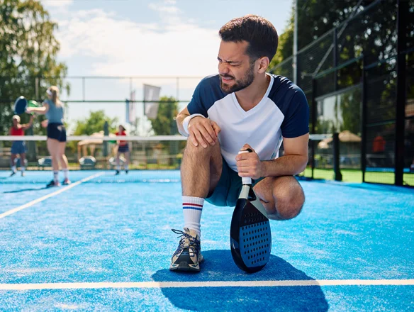 man with knee pain from playing pickleball