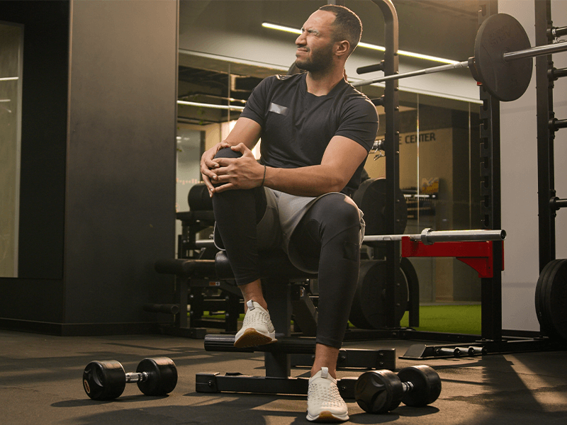 man with pain in knees from squatting