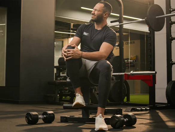 man with pain in knees from squatting